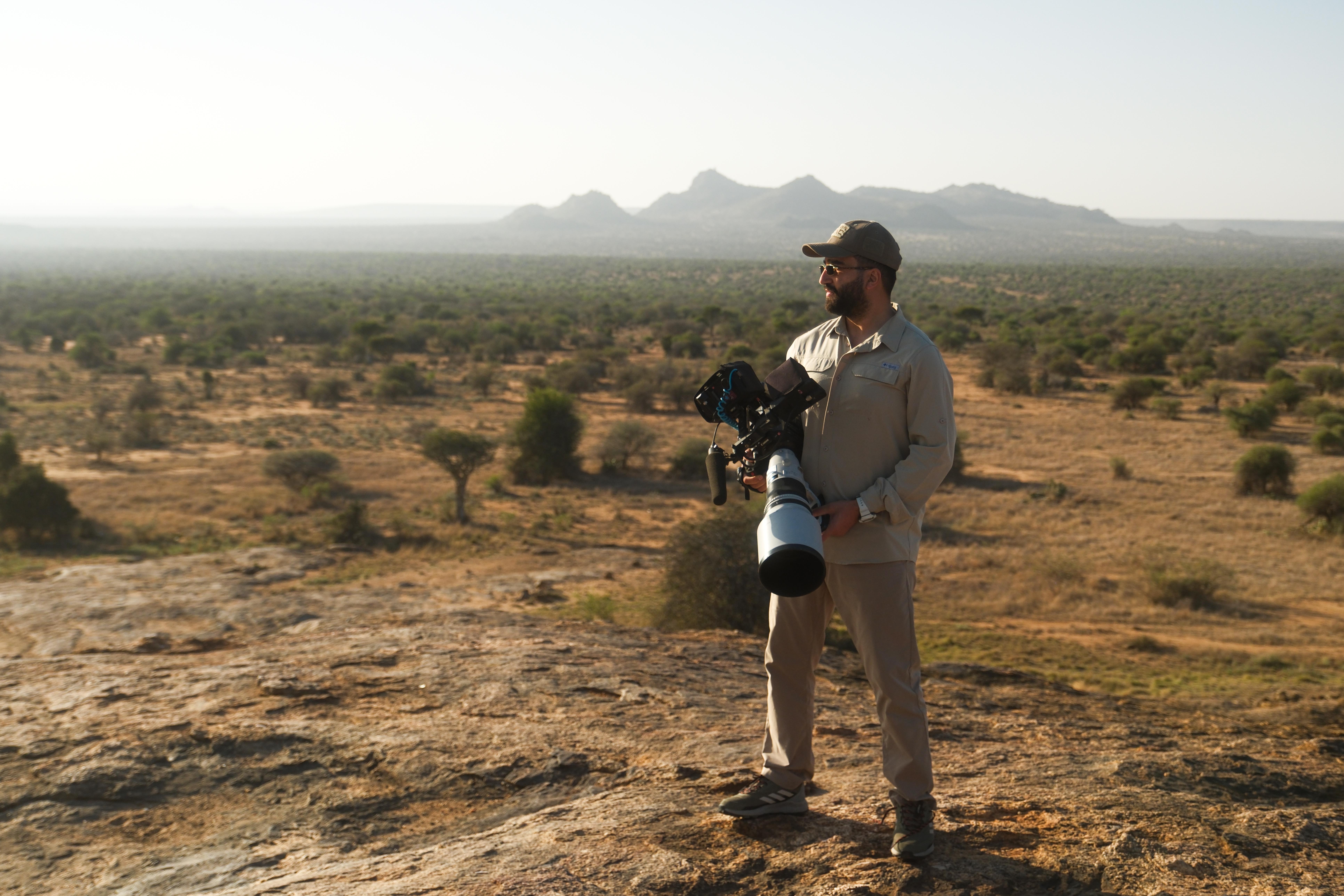 Hussein Salman with a cinema camera rig overlooking the desert